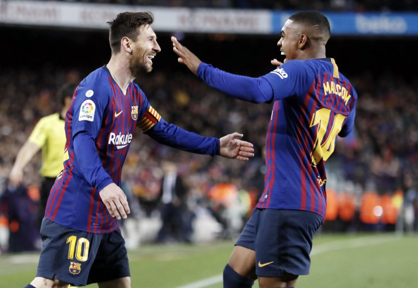 Una foto de Messi y Malcom celebrando un gol ante el Atlético de Madrid / FCB