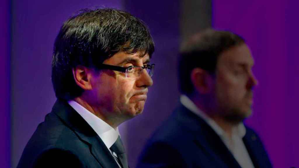 El presidente de la Generalitat, Carles Puigdemont, junto al vicepresidente Oriol Junqueras / EFE