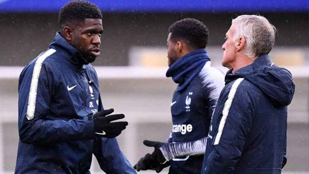 Samuel Umtiti con Didier Deschamps / EFE