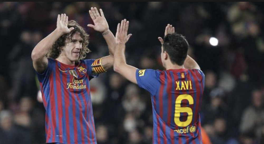 Una foto de Carles Puyol y Xavi Hernández durante un partido del Barça / EFE