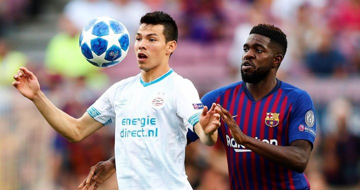 Una foto de Hirvin Lozano con Umtiti en el Barça - PSV / EFE