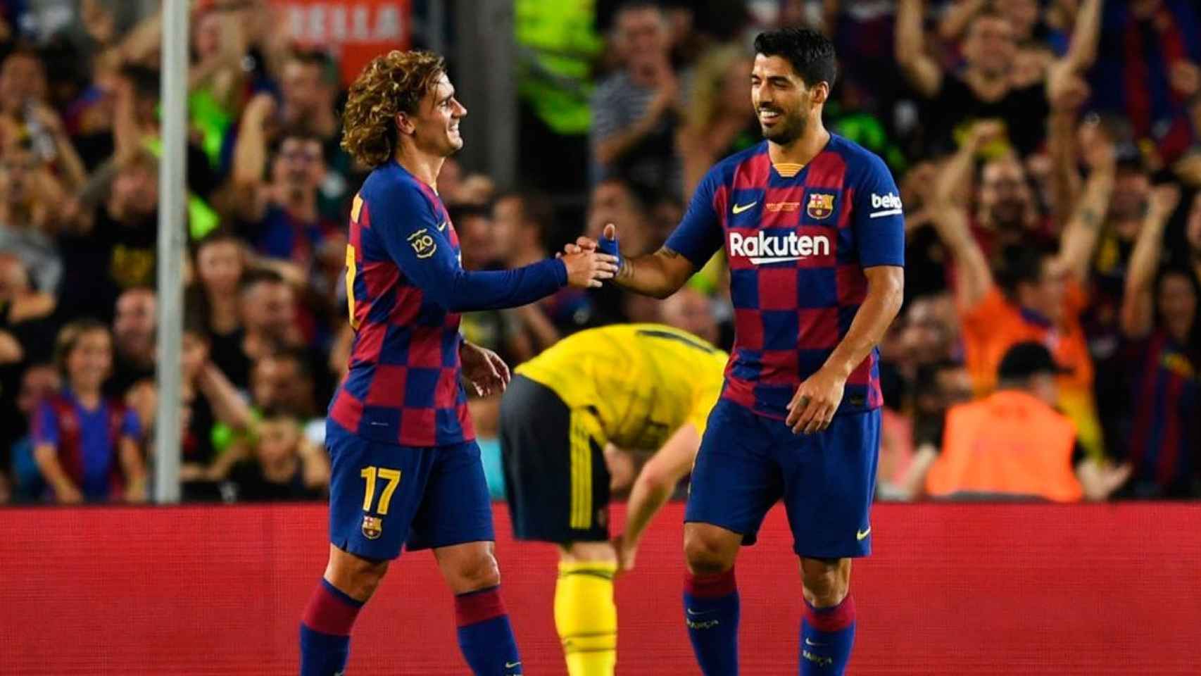 Griezmann, junto a Luis Suárez | EFE