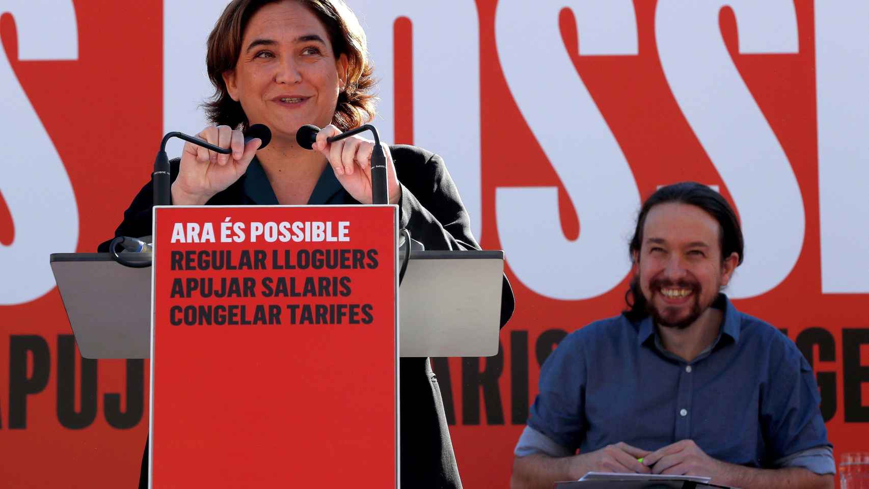 Ada Colau y Pablo Iglesias, durante el acto para explicar el impacto de los presupuestos / EFE