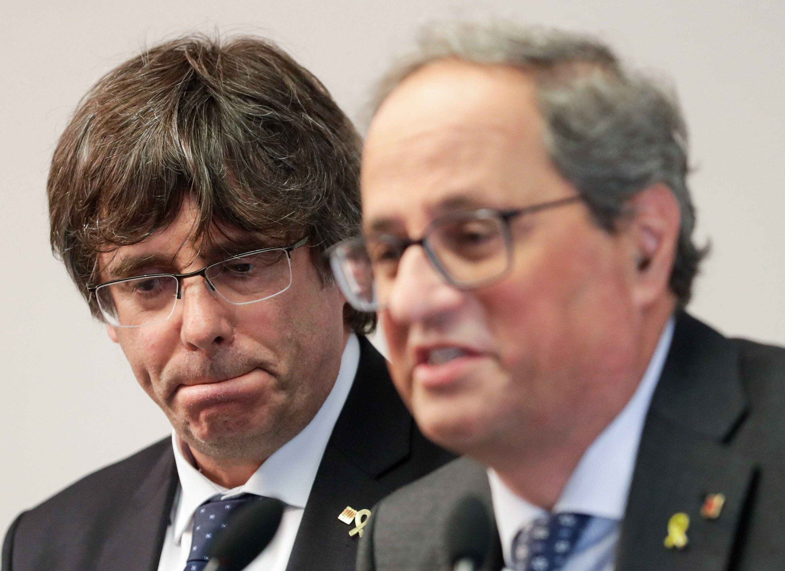 Los expresidentes de la Generalitat Carles Puigdemont y Quim Torra / EFE