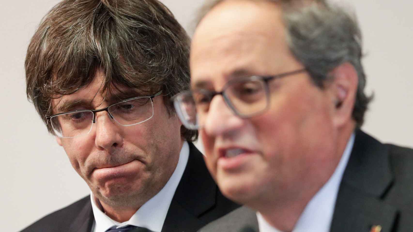 Los expresidentes de la Generalitat Carles Puigdemont y Quim Torra / EFE