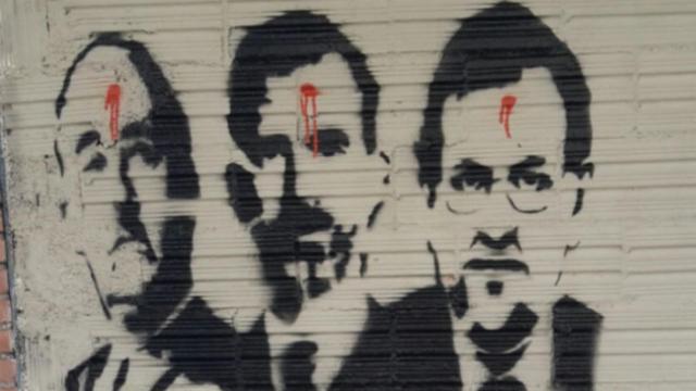 Grafiti del colectivo Arran en Sant Cugat amenazando a Felipe VI y a Rajoy