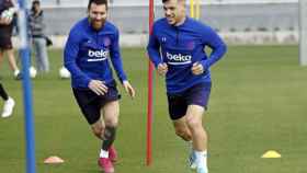 Una foto de Leo Messi y Carles Pérez durante un entrenamiento del Barça / FCB