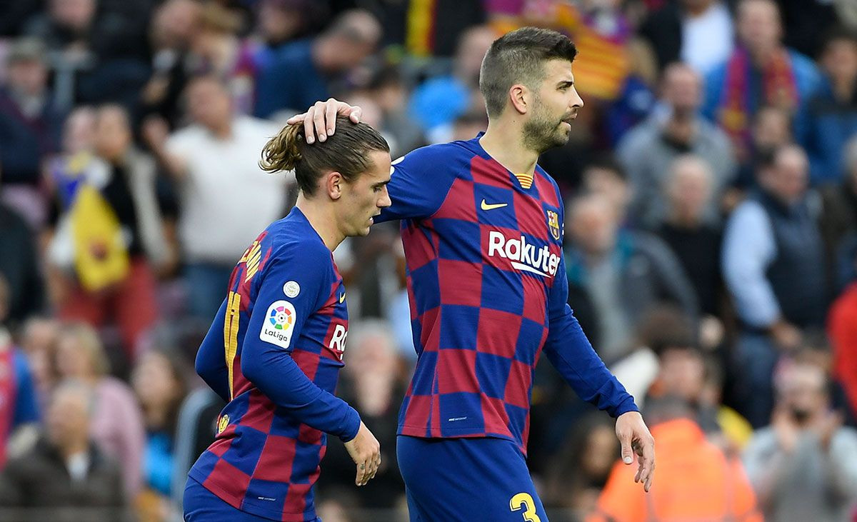 Piqué y Griezmann, en un partido con el Barça | EFE