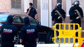 Imágenes del Grupo Especial de Intervención (GEI) de los Mossos d'Esquadra, en Cornellà ayer / EFE