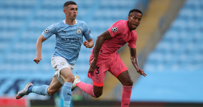 Foden y Miliao durante el Manchester City-Real Madrid / EFE