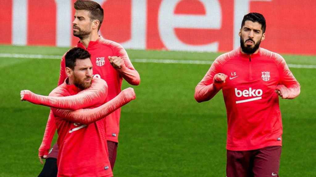 Messi, Gerard Piqué y Luis Suárez en un entrenamiento del Barça / EFE