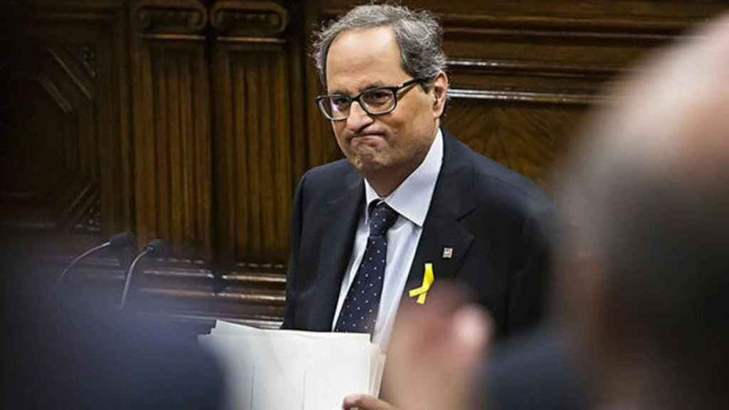 Quim Torra, con gesto apesadumbrado, en el Parlament / EFE