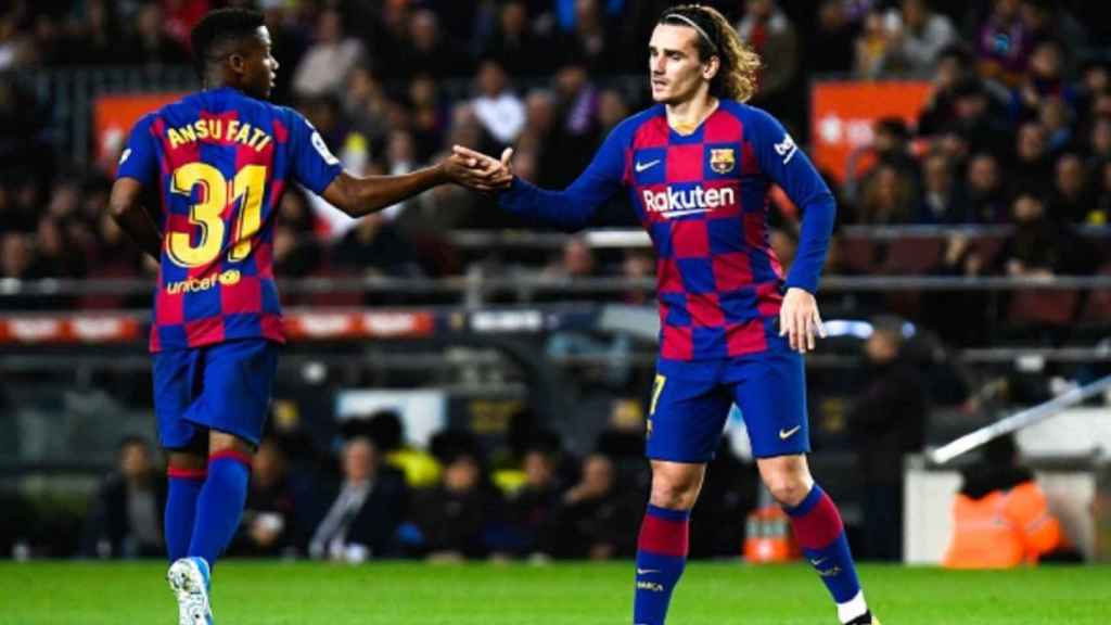 Griezmann, junto a Ansu Fati | EFE