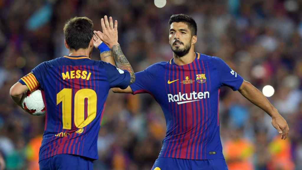 Leo Messi y Luis Suárez celebrando un gol del Barça