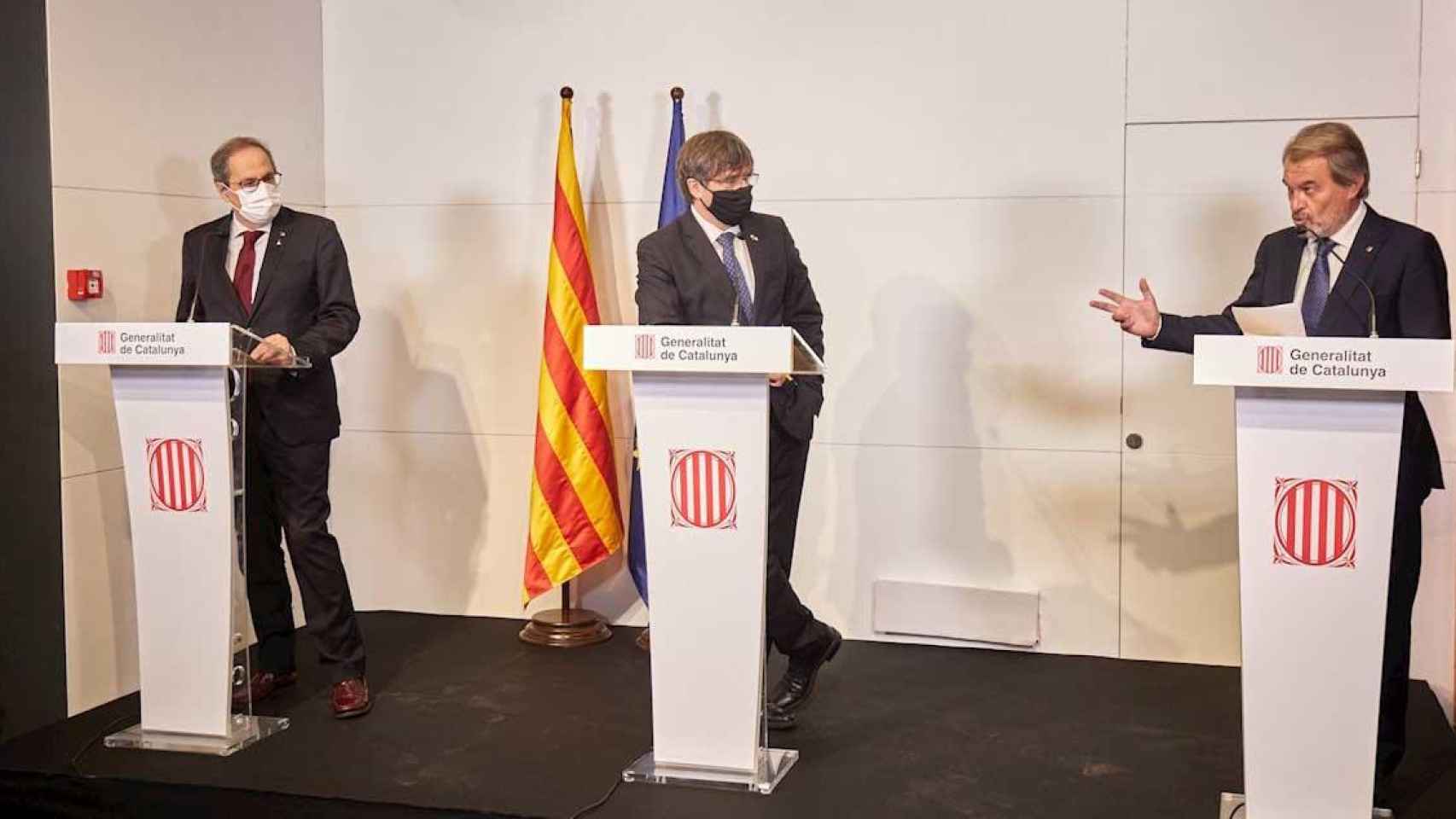 Los expresidentes Quim Torra, Carles Puigdemont y Artur Mas, en su comparecencia en Perpiñán / EFE