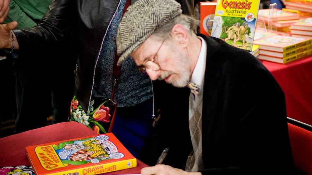 Robert Crumb firmando una copia de Genesis en 2012