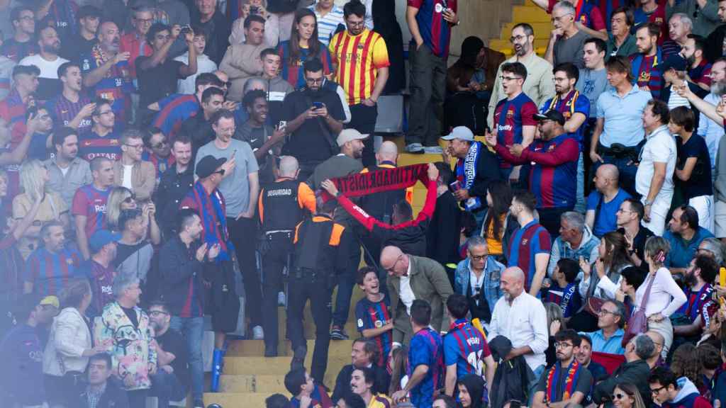 Peleas en las graderias en el clásico Barça - Real Madrid