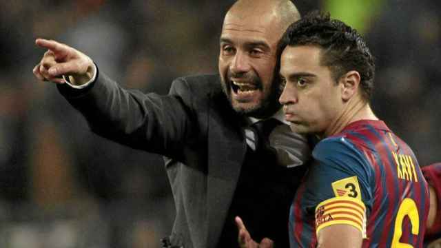 Pep Guardiola y Xavi Hernández