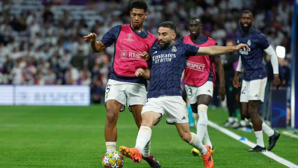 Jude Bellingham y Dani Carvajal, en el calentamiento previo al Real Madrid-Bayern