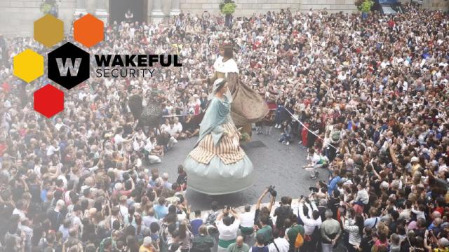 De fondo, una imagen de las fiestas de La Mercè de Barcelona con el logo de la empresa de seguridad Wakeful SA