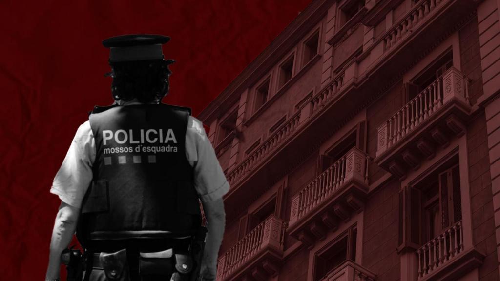 Un mosso de espaldas ante la fachada del bloque nº 15 del paseo de Gràcia