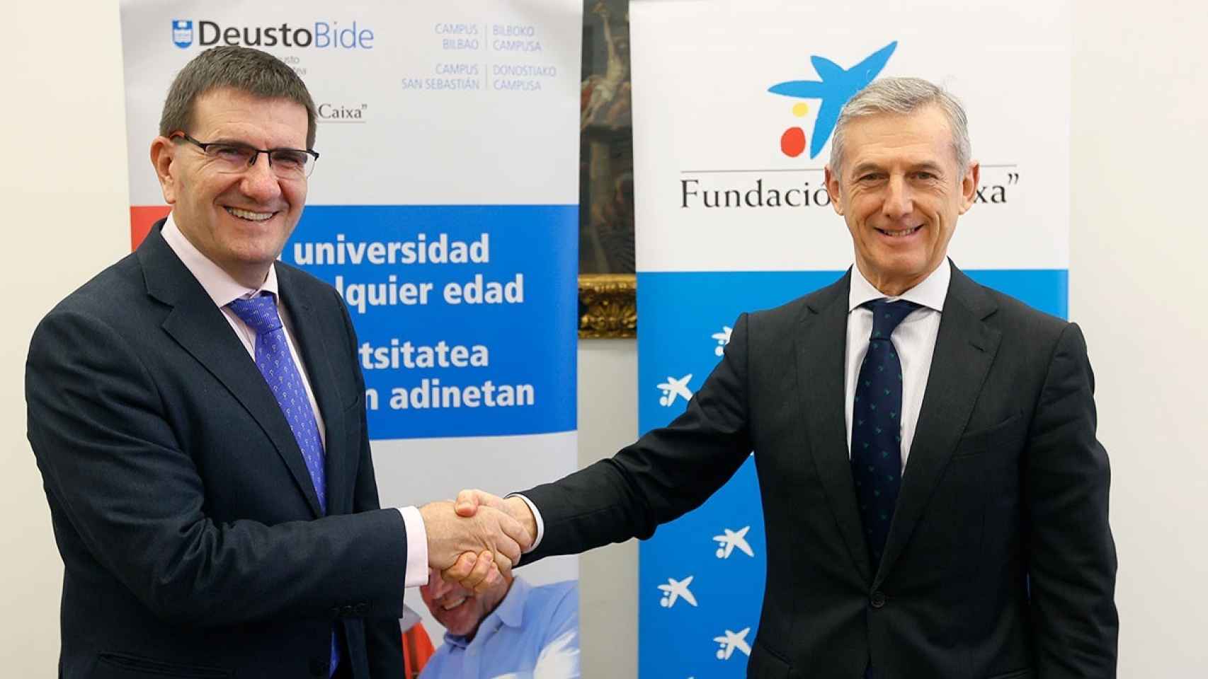 El rector de la Universidad de Deusto, Juan José Etxeberria, y el director territorial Norte de CaixaBank, Juan Pedro Badiola.